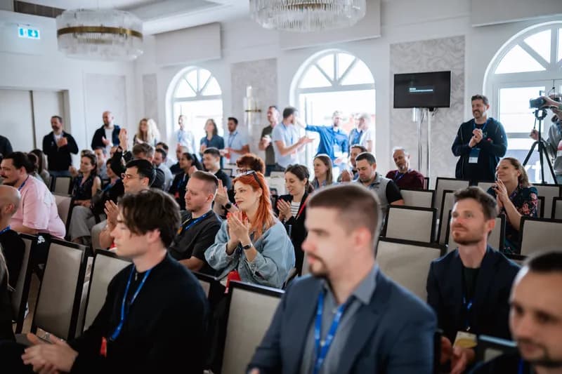 A group of people listening to a talk at one of SaaStanak 2025 stages